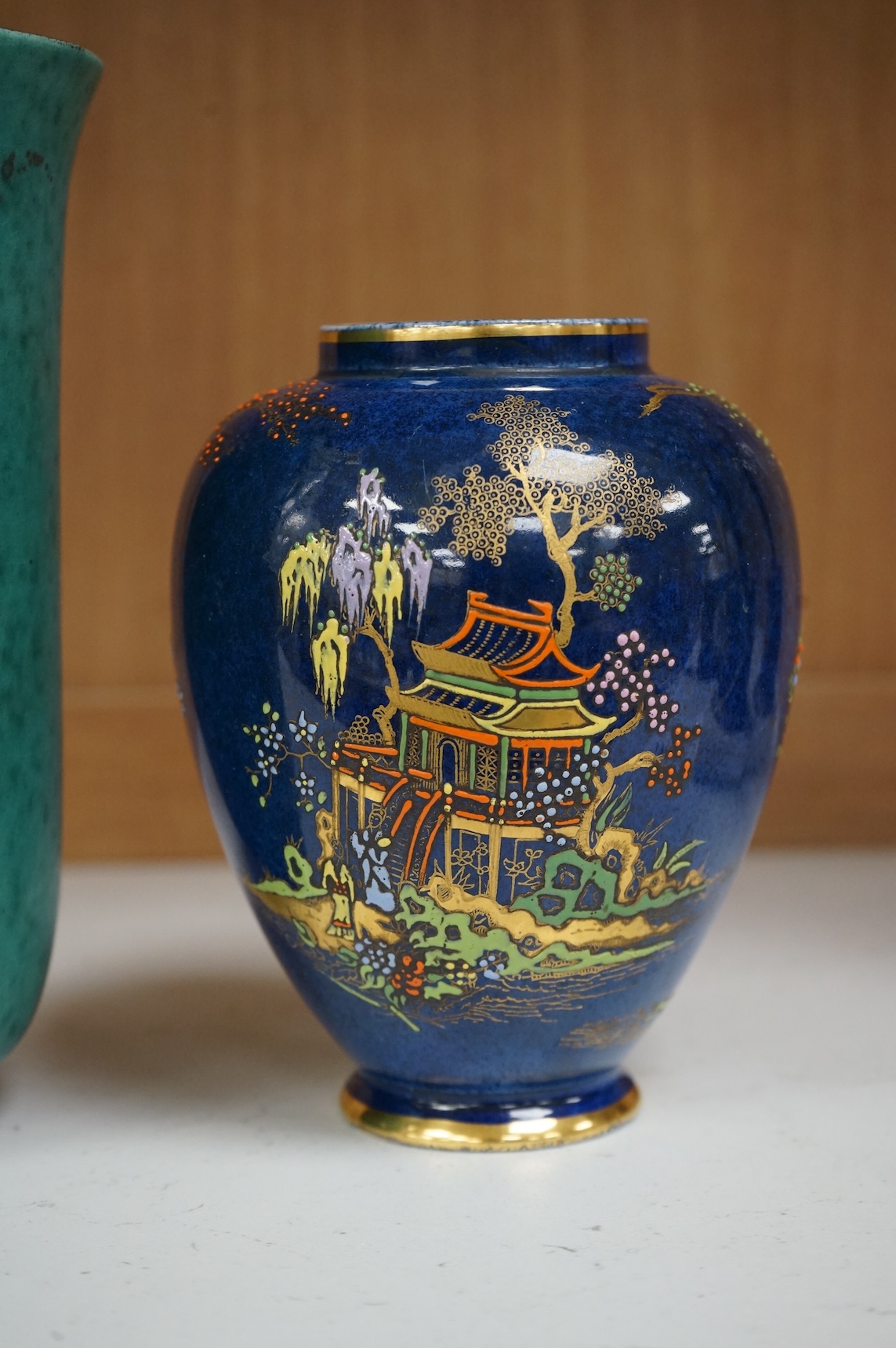 A Gustavsberg Argenta ware vase and a Carlton ware vase, tallest 16.5cm high.